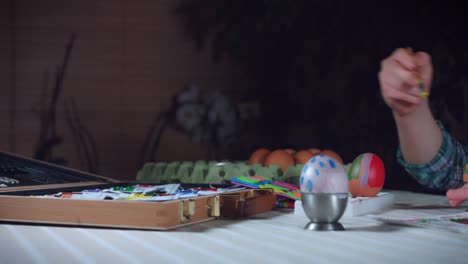 4K-Home-Shot-Of-Child-Painting-Easter-Eggs