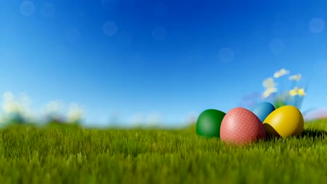 Easter-eggs-on-green-meadow-over-blue-blurry-sky