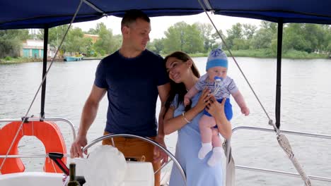 family-travel,-mum,dad-and-son-in-open-air,-happy-parents-with-child-on-rest-in-background-nature-and-water,-mother