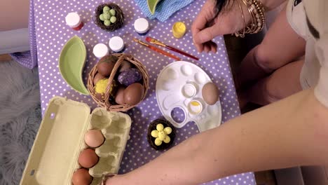 Woman-sorting-Easter-eggs