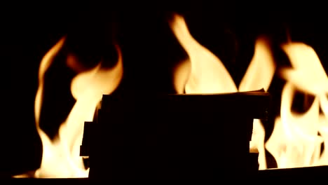 SLOW-MOTION:-Silhouette-of-stacks-of-money-on-fire-background