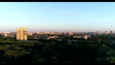 Aerial-photography.-City-park,-green-trees-and-tall-buildings.