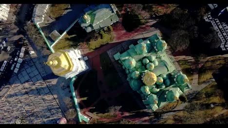 A-bird's-eye-view,-panoramic-video-from-the-drone-in-FullHD-to-the-Saint-Sophia's-Cathedral-Kiev,-Ukraine.-People-on-the-square-on-Easter-days.-Dolly-out-motion-and-drone-movement-counter-clockwise.