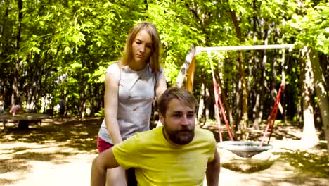 Young-disable-man-on-a-walk-in-the-park-with-his-wife