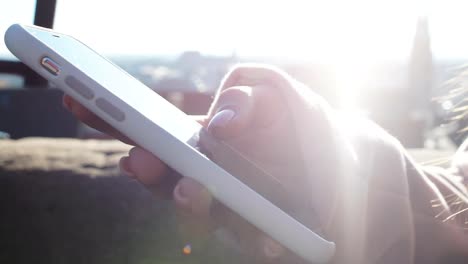 Woman-scrolling-app-on-cell-phone,-using-gps-navigation-or-map-to-find-hotel