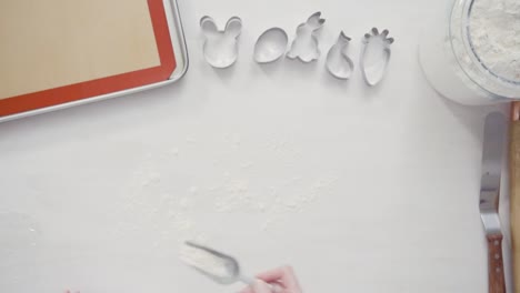 Cutting-sugar-cookie-dough-with-Easter-shaped-cookie-cutters.