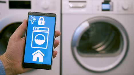 Smart-home-app-on-mobile-phone-wirelessly-controls-washing-machine