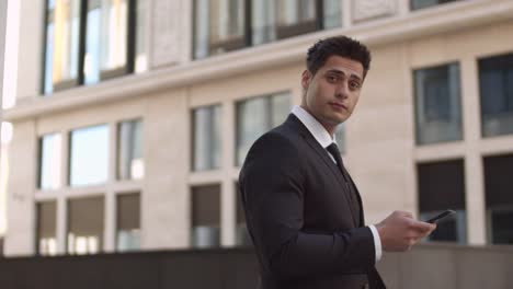 Handsome-Businessman-Using-Phone