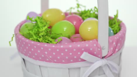 Easter-basket-with-easter-eggs-on-a-white-background.