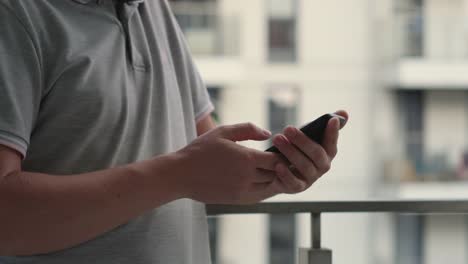 man-is-typing,-swiping-and-scrolling-on-screen-of-smartphone,-closeup