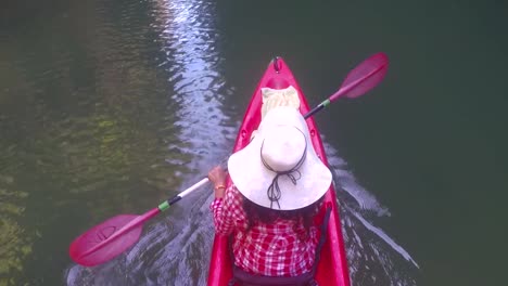 Woman-Kayaking-In-Lagoon-Top-Angle-View-Action-Camera-POV-Of-Girl-Paddling-On-Kayak-Boat