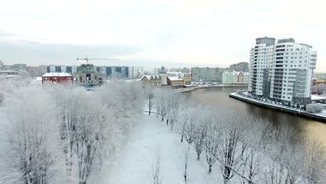 Aerial:-Snow-capped-Fishing-Village-of-Kaliningrad,-Russia