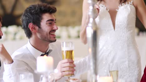 Couple-Socialising-At-Their-Wedding