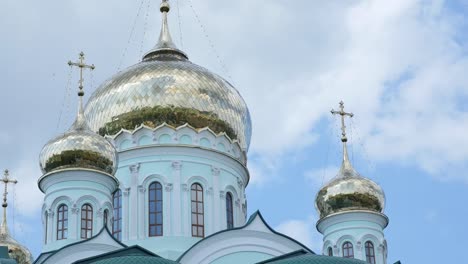 country-church-steeple-against-blue-sky-and-white-clouds