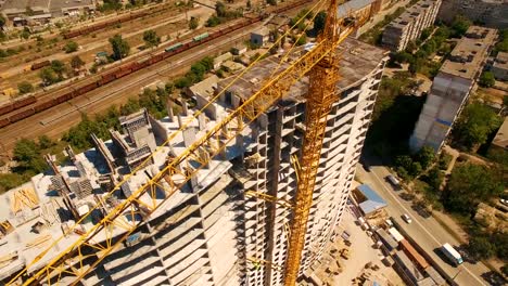 Aerial-shoot-of-construction-site-with-tower-cranes.-Construction-drone-footage