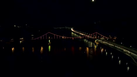 Aerial-view-from-Drone:-Top-view-of-the-night-promenade-with-bridges-and-cars.