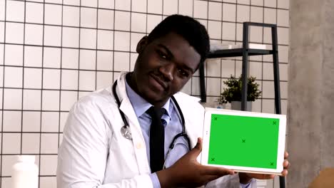 Smiling-doctor-presenting-product-on-a-tablet-computer.-White-Display