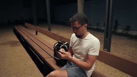 Guy-alone-in-evening-with-smartphone.