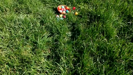 colorful-easter-eggs-in-the-fresh-spring-meadow,-aerial-view