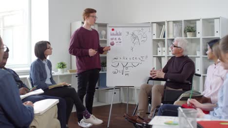 Student-Talking-to-Mature-Teacher-in-Wheelchair