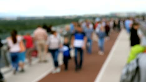 Blurred-shotting-of-crowd-anonymous-people-walk-and-relax.