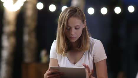 Worried-woman-is-checking-tablet-online-content.-Shocked-emotion