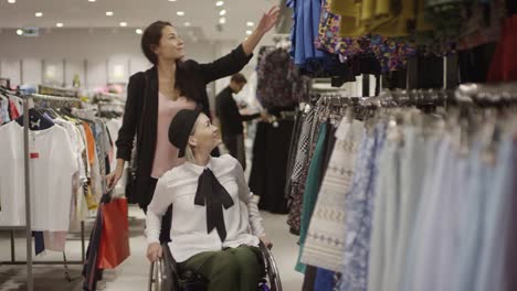 Woman-in-Wheelchair-Shopping-for-Clothes-with-Friend