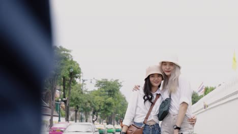 Two-girls-Asian-lesbian-couples-enjoying-traveling-in-Thailand.-Beautiful-young-women-having-fun-in-vacation-time.-LGBT-concept.