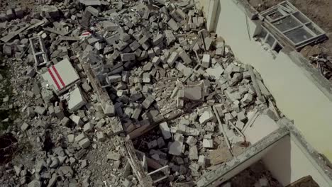 Ruins-of-a-small-white-house-located-in-the-village.-View-from-above