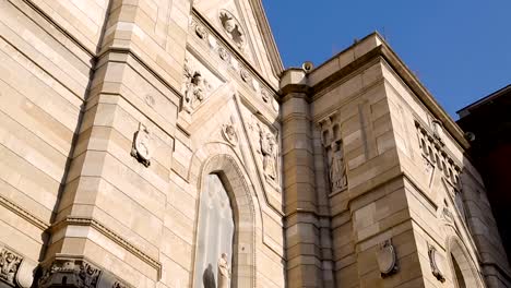 Panorama-of-ancient-facade-of-Naples-cathedral,-view-on-marble-statues,-sequence