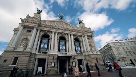 LVOV,-UKRAINE---Winter-2018-Timelapse:-Сold-weather-in-old-city-Lviv-in-Ukraine.-Clouds-are-moving-quickly.-People-are-walking-along-the-street-near-Lviv-Opera-and-Ballet-Theatre.