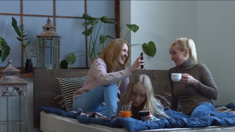 Cheerful-women-chatting-and-gossiping-at-home