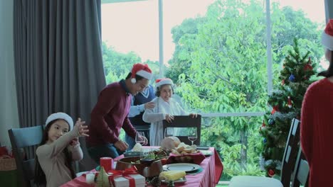 Senior-man,-grandfather-invite-family-to-come-for-dinner-and-having-meal-together-in-dining-room