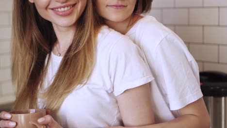 A-young-couple-of-lesbians-gently-cuddle-at-home.