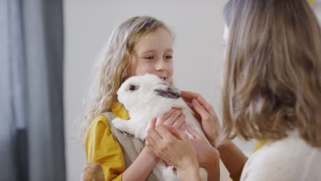 Cute-Girl-Holding-Bunny