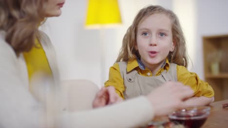 Sequence-of-Woman-and-Girl-Dyeing-Eggs-for-Easter