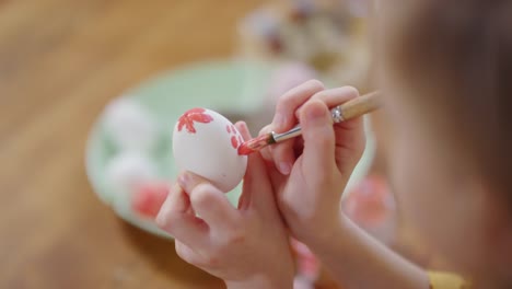 Sequence-of-Happy-Girl-Decorating-Easter-Egg