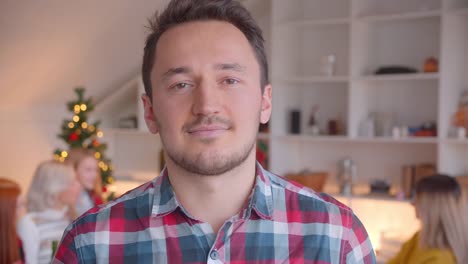 Close-up-portrait-of-a-young-man-new-year-christmas-family-evening-smiling