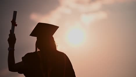 abstract-Close-up-Rear-view-of-the-university-graduates-at-Silhouette-sunset