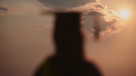 abstract-Close-up-Rear-view-of-the-university-graduates-at-Silhouette-sunset