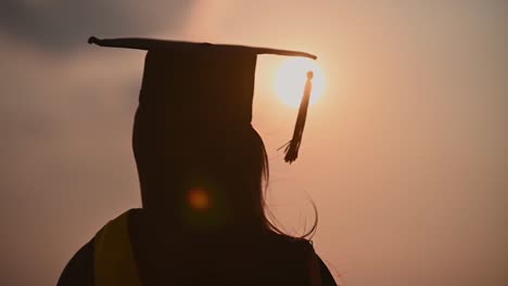 abstract-Close-up-Rear-view-of-the-university-graduates-at-Silhouette-sunset