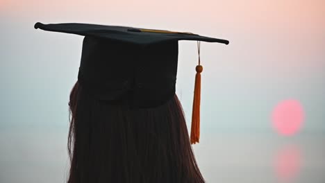 Abstract-Close-up-Rear-view-of-the-university-graduates-at-Silhouette-sunset