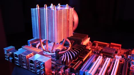 closeup-of-a-rotating-processor-CPU-fan-installed-on-the-motherboard-on-a-black-background