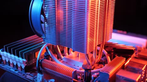 closeup-of-a-rotating-processor-CPU-fan-installed-on-the-motherboard-on-a-black-background