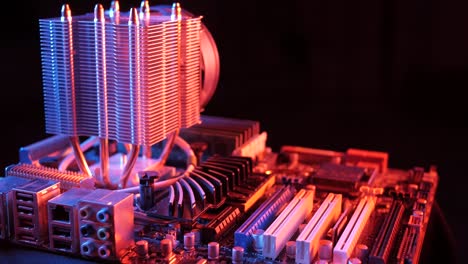 closeup-of-a-rotating-processor-CPU-fan-installed-on-the-motherboard-on-a-black-background