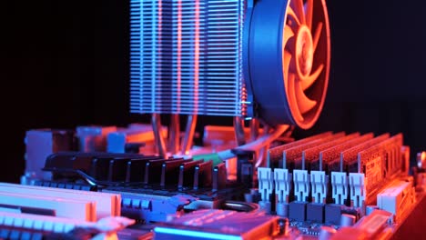 closeup-of-a-rotating-processor-CPU-fan-installed-on-the-motherboard-on-a-black-background