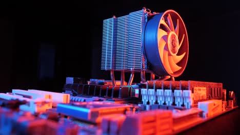 closeup-of-a-rotating-processor-CPU-fan-installed-on-the-motherboard-on-a-black-background