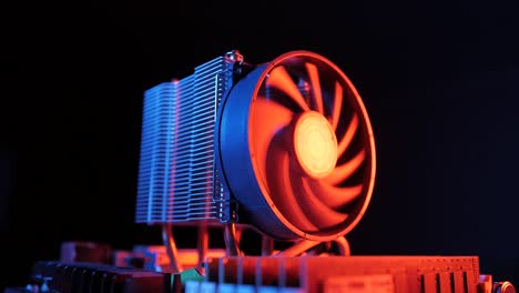 closeup-of-a-rotating-processor-CPU-fan-installed-on-the-motherboard-on-a-black-background