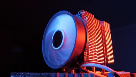 closeup-of-a-rotating-processor-CPU-fan-installed-on-the-motherboard-on-a-black-background