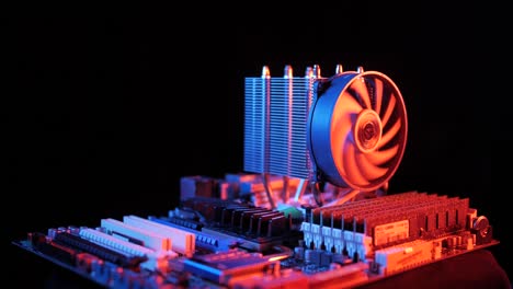 closeup-of-a-rotating-processor-CPU-fan-installed-on-the-motherboard-on-a-black-background